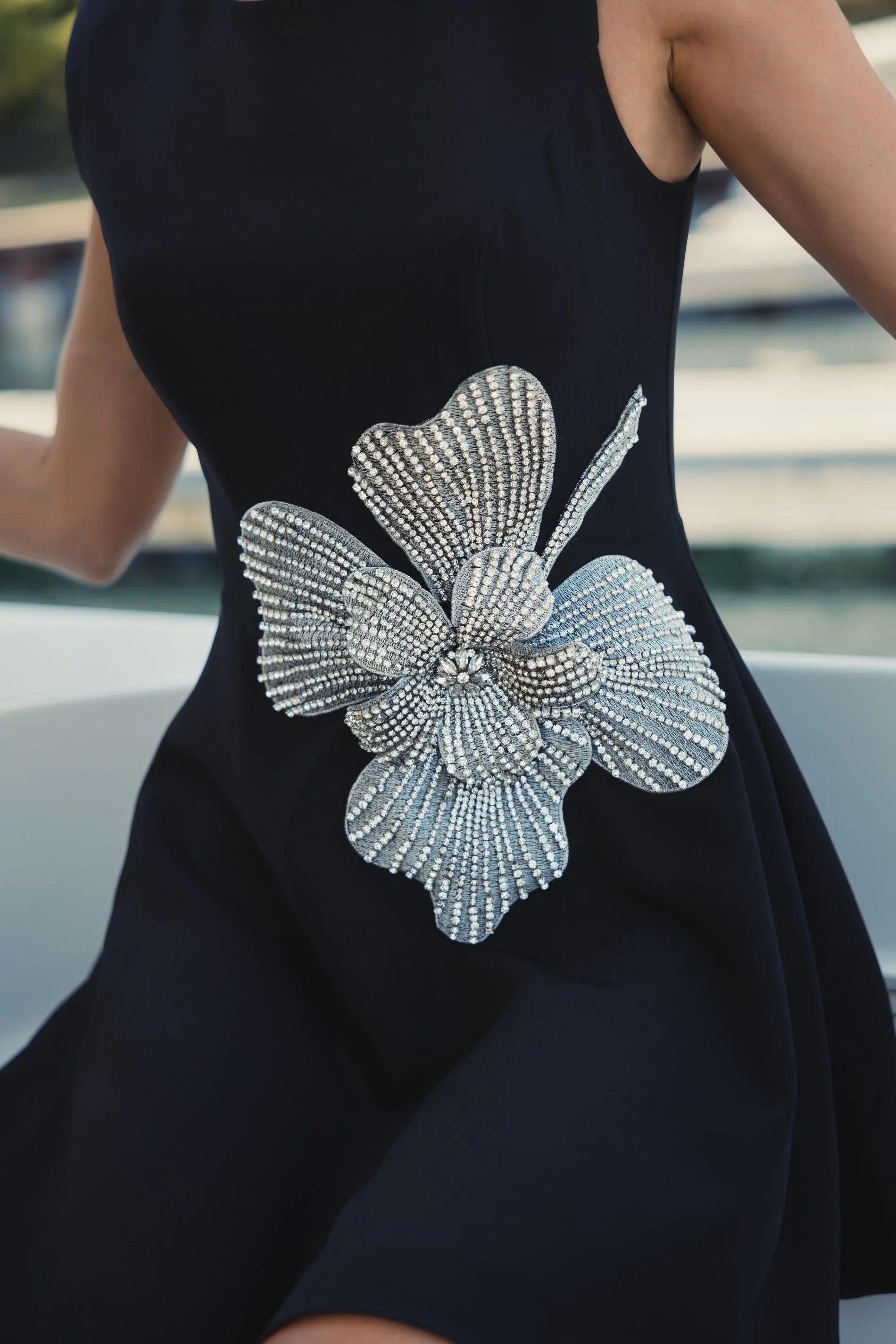 Black Crepe Sleeveless Mini Dress With Rhinestone Flower